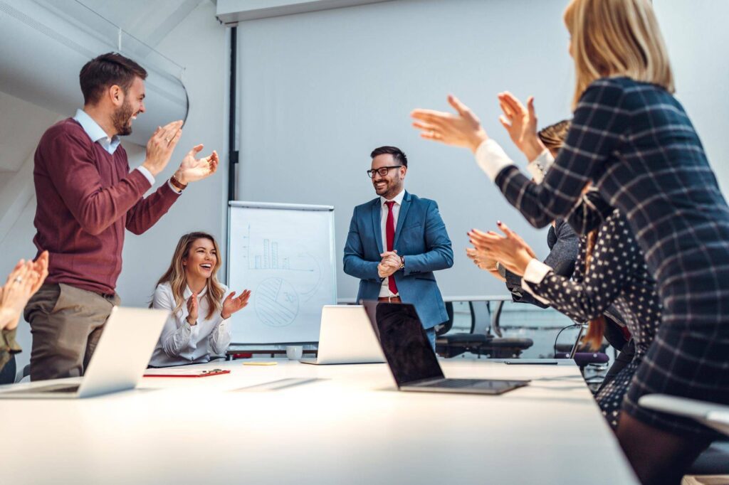 Shot-group-coworkers-applauding-after-successful-presentation-boardroom - Rupetta Consultancy - Rupetta Consultancy Rupetta Consultancy - Business Consultation