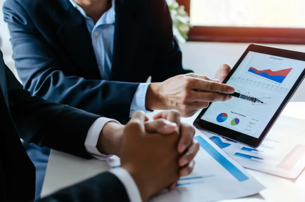 Partner-business-man-investor-team-brainstorming-planning-about-financial-statistics-chart-information - Rupetta Consultancy - Rupetta Consultancy Rupetta Consultancy - Competitor Analysis Service